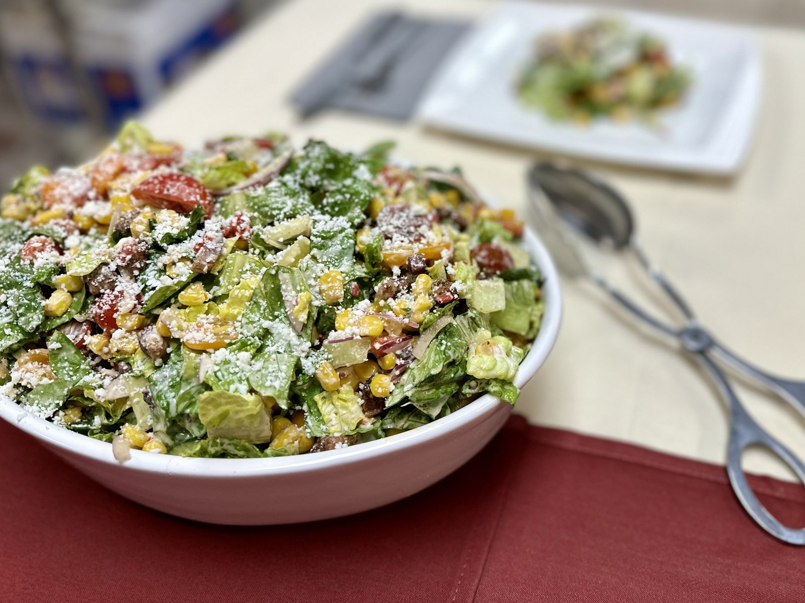 Texas chop salad with tomatoes, corn, greens and cotija cheese