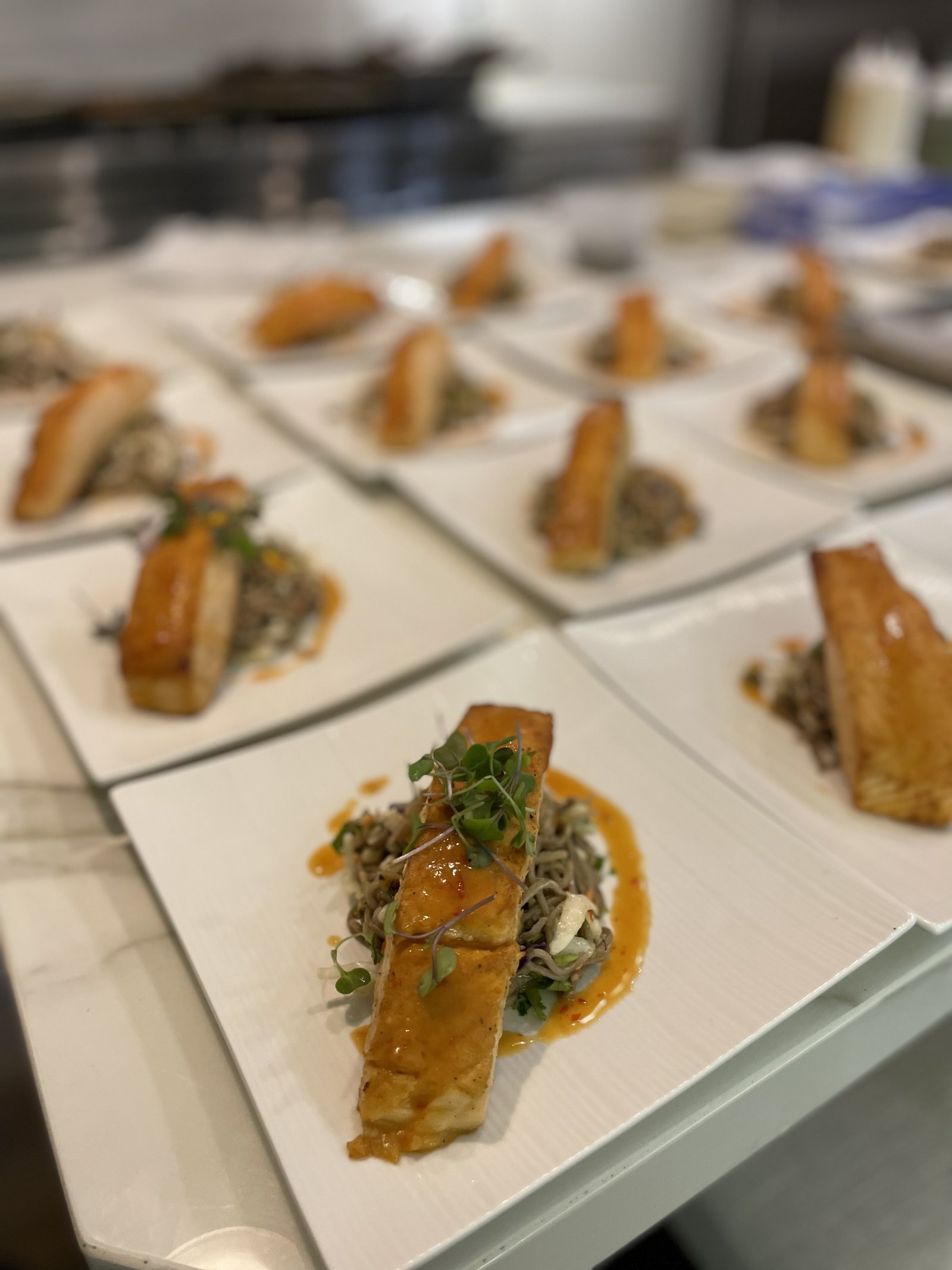 Miso glazed salmon served over cold soba noodle salad