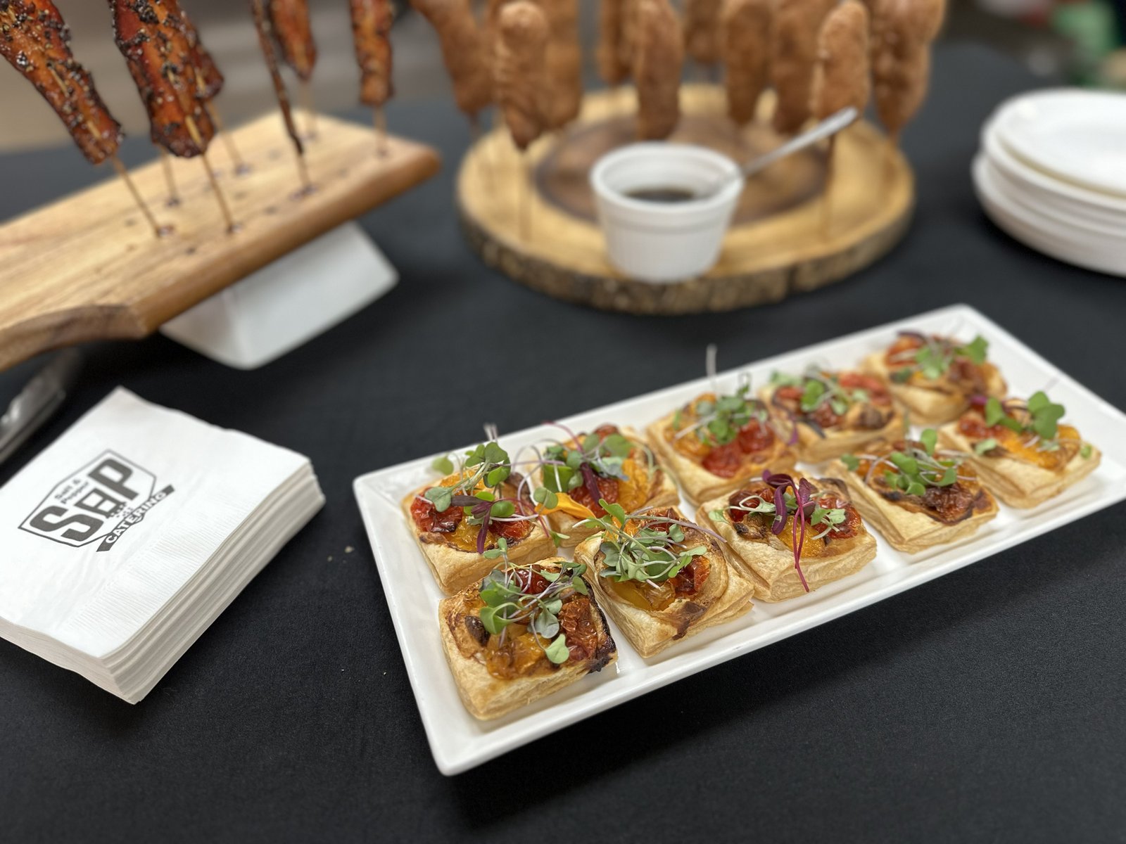 Heirloom tomato puff pastry tarts with colorful garnish